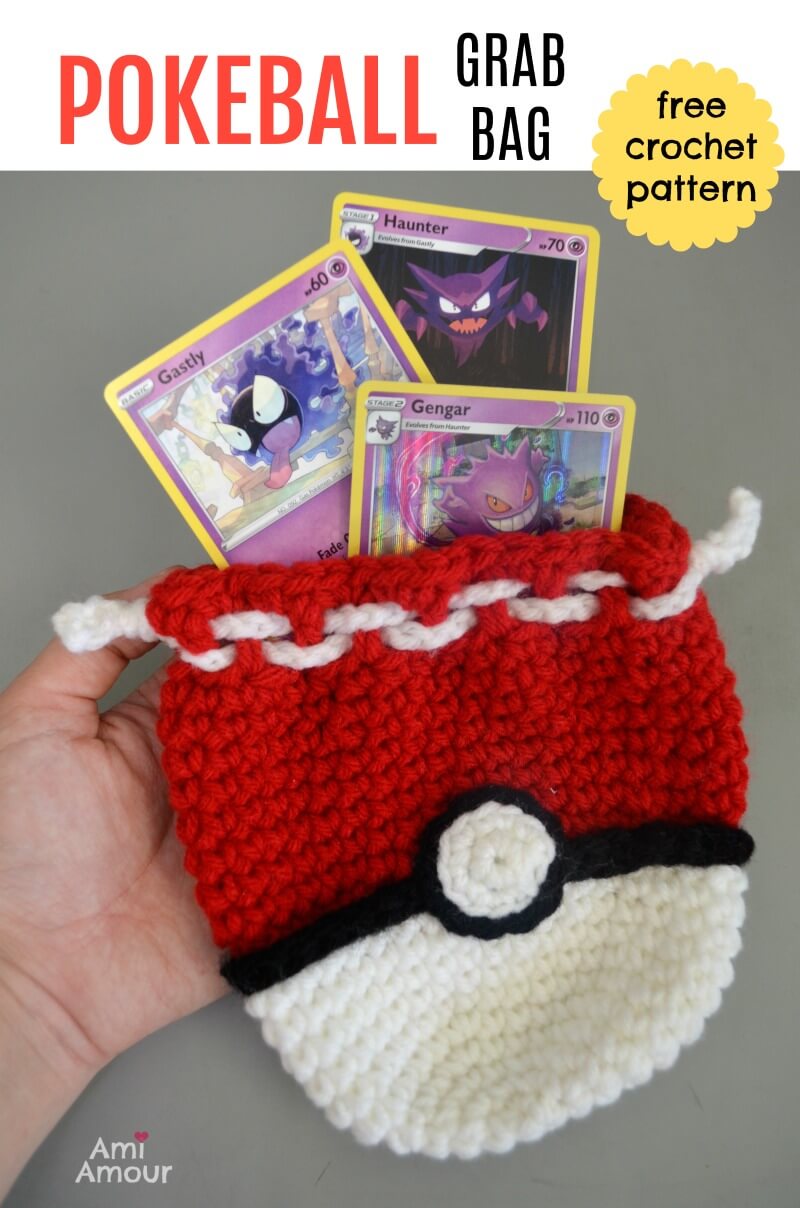Finished crochet Pokeball pouch with drawstring cords visible