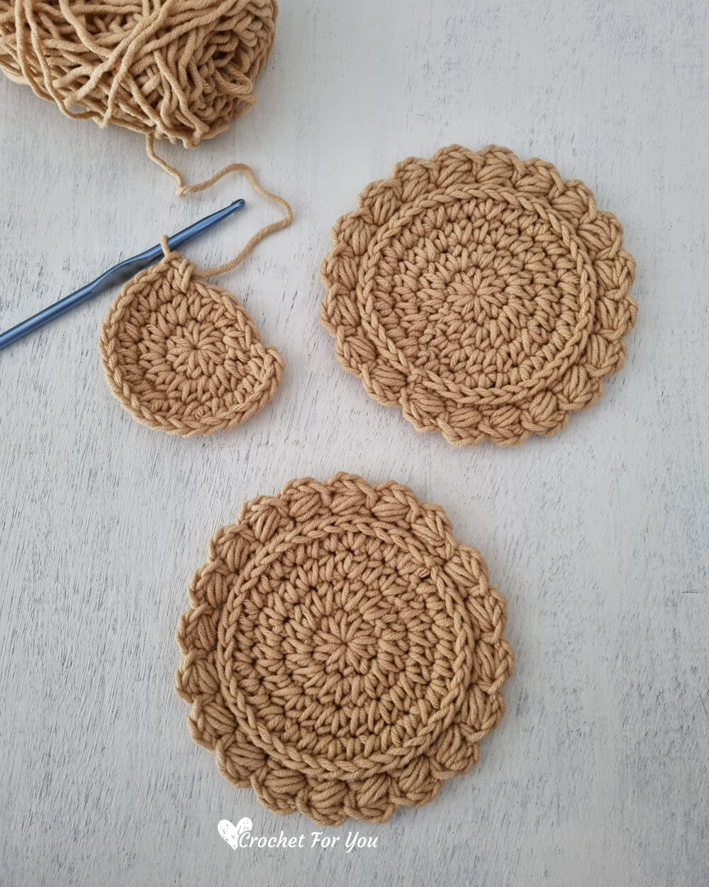 Close view of textured handmade crochet coasters