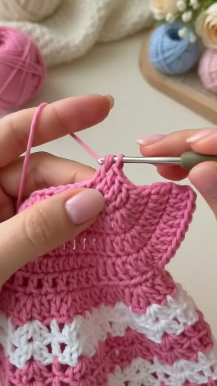 Crochet baby dress with booties in pink and white for infants