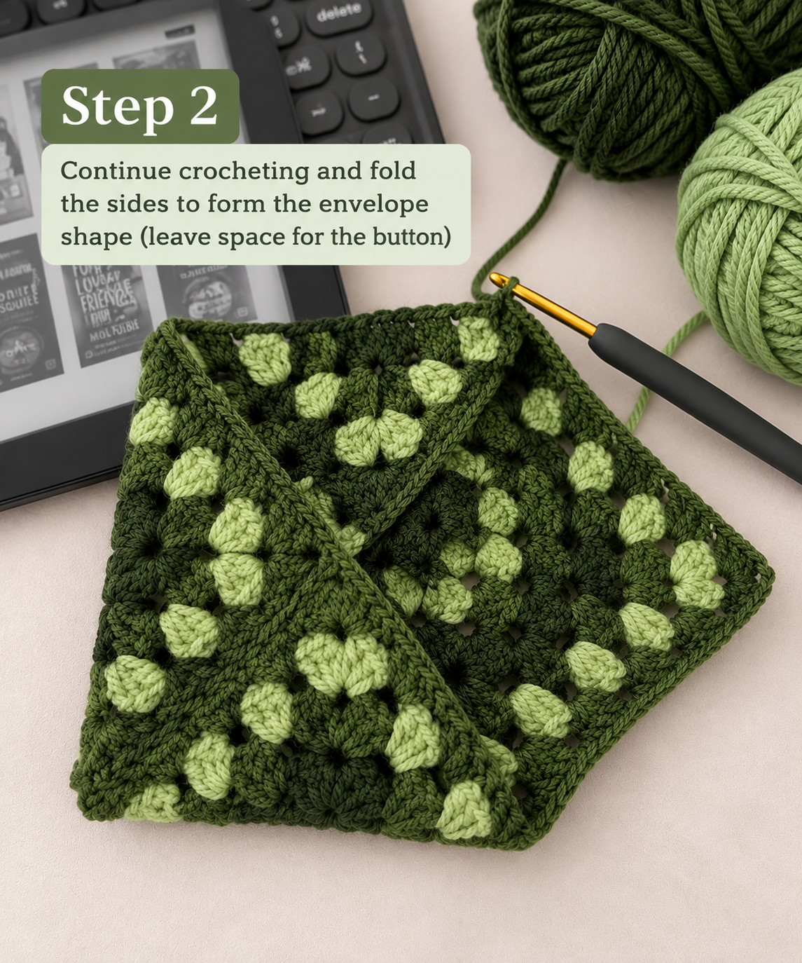 Step 2 folding a green granny square into an envelope crochet pouch